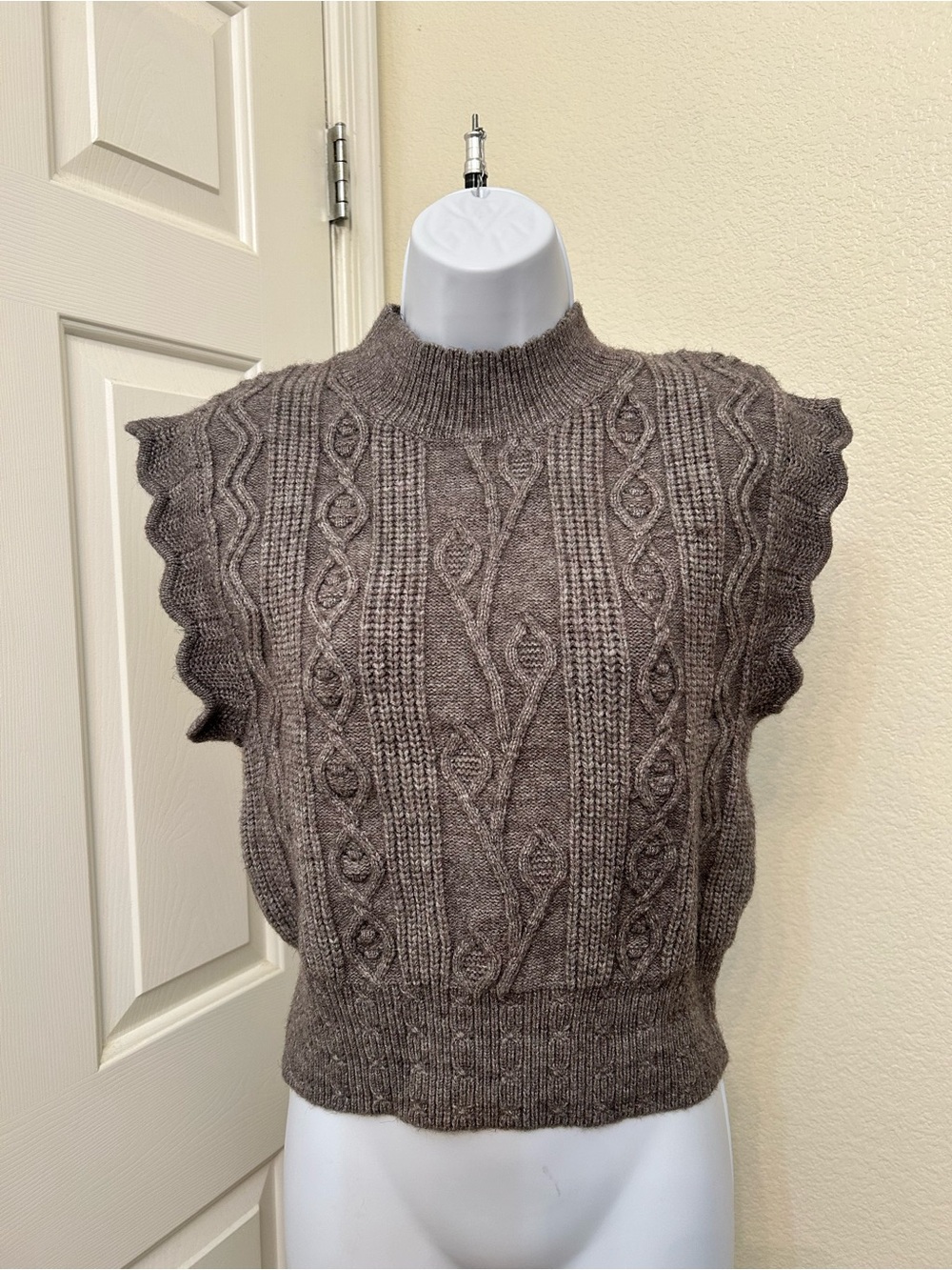 Sleeveless Cable Knit Mock Neck Sweater